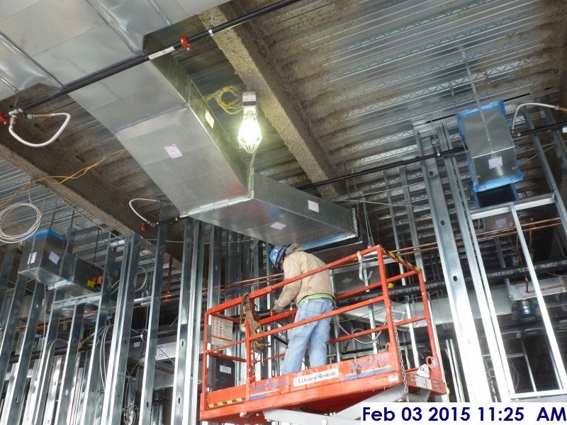 Installing ductwork at the 3rd floor Facing North